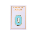 Close-up of light blue chenille letter O patch with gold glitter borders and self-adhesive back - Light Blue Letter O