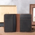 Detailed view of handmade leather card holder with vintage texture and orange stitching - 1052 Deep Brown