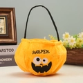 Orange plush Halloween pumpkin treat bag with custom Harper embroidery and black handle - Hannya Mask