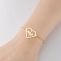 Minimalist gold heart bracelet featuring heartbeat design on woman's wrist - 368-Heart Heartbeat