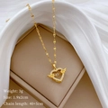 Détail du collier cœur doré avec ailes, cristaux étincelants et dimensions du produit - Doré