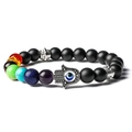 Detail of Hamsa Hand and Evil Eye charm on chakra beaded stone yoga bracelet - Matte Stone Bracelet