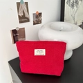 Minimalist red corduroy cosmetic bag with woven logo label for portable storage - Red