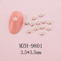 Detail view of 3.5x3.5mm pearl flower nail art charms with golden bead centers - 3.5mm Pearl White Gold Core Flower (9801)