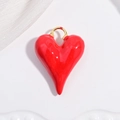 Close-up of a red heart pendant with a glossy enamel finish and gold ring connector - VD1664 Gold Red Enamel Long Heart