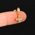 Macro shot of gold butterfly dangle cartilage stud earring with cubic zirconia accents - CC167-2 Gold Butterfly