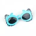 Close-up of kids crocodile sunglasses with pirate hat details and blue plastic frames - Blue