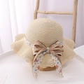Detailed weave texture of kids beige straw hat with floral bow and wavy brim edge - Kids (52-54cm) / Khaki Hat