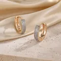 Macro shot of gold-plated hoop earrings with pave-set cubic zirconia on silk and stone - B5-13 Gold Pave Zircon Hoop