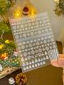 Detailed view of silver laser Christmas nail stickers featuring snowflakes and reindeer - Holographic YT3738 (Silver Laser Xmas)