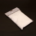 Künstliches weißes Schneepulver in Klarsichtverpackung für Weihnachtsdeko auf schwarzem Grund - 50g/Beutel (Deckt ca. 0,4 qm ab)