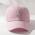 Close-up of fine white daisy embroidery on a light pink cotton baseball cap crown - Pink