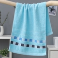 Sky blue cotton towel with blue and white checkered decorative trim hanging on a bar - Cotton Weak Twist Plaid Blue (Gift Pack)