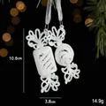 White glitter spiral candy Christmas ornaments with ribbons on festive bokeh background - Double Candy Style