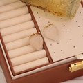 Cute strawberry stud earrings in cream white with gold leaves on brown leather box - White