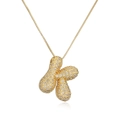 Gold plated peanut pendant necklace with sparkling pavé crystals on white background - Letter K