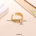Gold stainless steel twisted ring with oval clear zircon stone in an open design - White