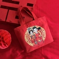 Bolsa de regalo de boda roja en lona con ilustración de novios y cierre de presión - Pareja Ideal