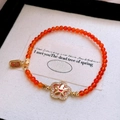 Red agate bracelet with a gold smiley flower charm and fortune engraved gold tag - 25# Bracelet - Gold and Red