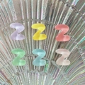 Close-up of mini resin alphabet Z charms in colorful transparent finishes for DIY crafts - Letter Z