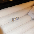 Macro detail of elegant pearl earrings with sparkling zircon halo on beige velvet - White Zircon Pearl Studs (Silver Pin)