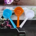 Detailed view of plastic measuring spoons in three colors with convenient pouring spouts - 5g Colored Short Handle (5.7*2.8*2cm) / Color (Random)