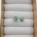Elegant gold four-prong stud earrings with natural light green raw stone crystals - Green Aventurine