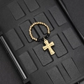 Macro detail of elastic beaded ring featuring golden beads, black crystals and cross charm - Black Bead Cross Style (F-R584)
