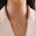 Minimalist gold beaded necklace featuring a smooth water drop pendant on a dainty chain - Letter I