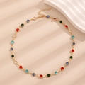 Close-up of golden necklace with colorful round crystals and lobster clasp closure - KC Gold Multicolor Gemstone Necklace (11779)