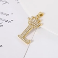 Macro shot of gold-plated letter L pendant with crown and micro-pave cubic zirconia - Letter L