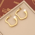 Detail of irregular gold geometric earrings with white pearls on a beige jewelry box - Irregular Pearl Style (9#)
