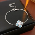 Detail of vintage silver bracelet with turquoise clover charm and pearls on black leather box - Pearl Turquoise Heart Flower Style