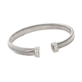 Detailed shot of a silver crossover bangle with shimmering rhinestones on a white background - 8mm Silver Open Bangle