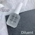 Nail art blooming thinner 15ml bottle for marble watercolor effects in minimalist studio setting - Clear Thinning Solution