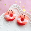 Macro view of colorful resin donut charms with cute expressions for DIY crafting - Orange Base