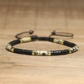 Detail view of woven beaded bracelet with imperial stone and adjustable black cord strap - No.73 Spotty Black Matte