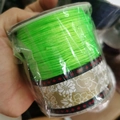 Spool of vibrant bright green jewelry cord for DIY handcrafted bracelet weaving - 1.0MM A-Line Large Roll / Fluorescent Green