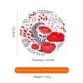 Round ceramic coaster featuring red flower and bird motifs, 10.8cm diameter design - Pink Coaster