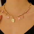 Bohemian woven gold chain necklace with pink starfish, seahorse, and shell charms - Gold Multi-Pendant Ocean Element Necklace (8343)