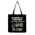 Detail view of durable black canvas nurse tote bag with humorous nursing school print - Black Nursing School Humor Slogan Style (hm6981)