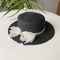 Black straw boater hat with a large white organza bow and pearl accent for women - Black