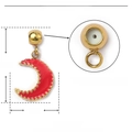 Detail view of gold moon pendant with red enamel showing internal rubber stopper - Red Moon