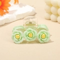 Hair claw clip with light green camellia flowers and yellow stamens on clear base - Green