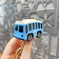 Mini blue bus keychain toy featuring gold hardware and intricate vehicle details - Doraemon Car Keychain - City Bus