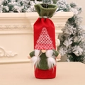 Christmas wine bottle cover featuring a red and green Swedish gnome with a long beard - Braid Style