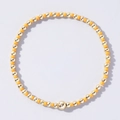 Handmade Bohemian beaded bracelet with vibrant orange beads and polished gold accents - Matte Orange and Gold