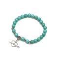 Vintage turquoise beaded bracelet set with silver heart pendant on white background - Heart