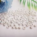 Macro shot of silver filigree flower bead caps for DIY jewelry making accessories - 6mm Flower Cap / Silver