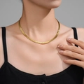 Elegant gold flat snake chain necklace on model neck in PVD plated stainless steel - Gold Embossed Flat Snake Chain